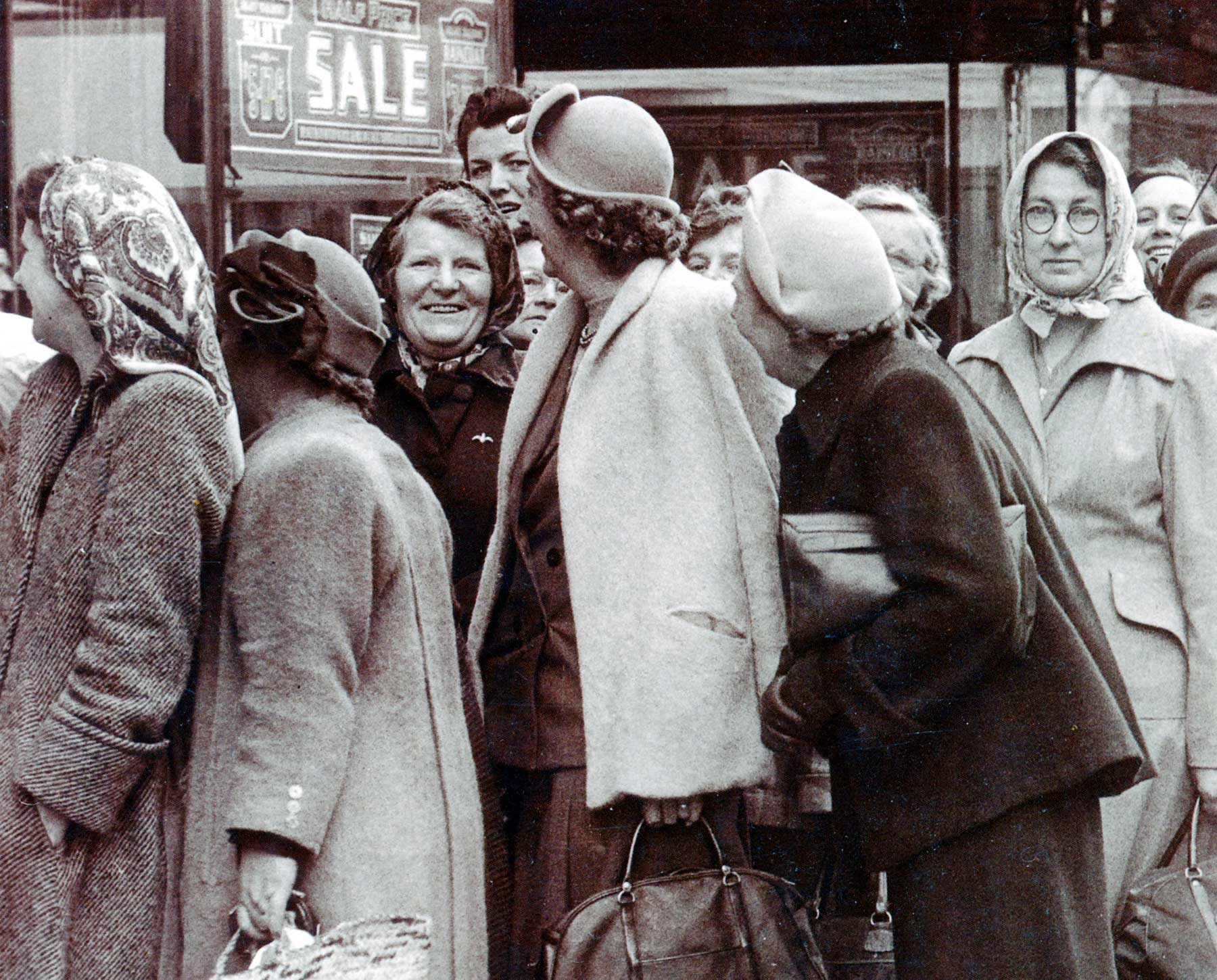 Shoppers queue in Bristol, England in the 1950s