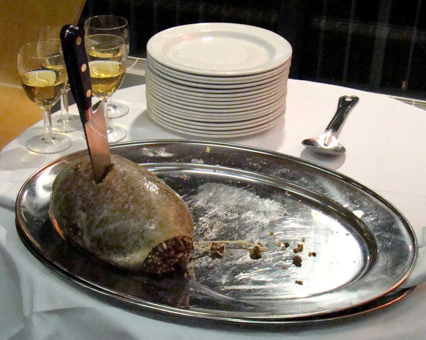 Haggis on a platter with a knife in it