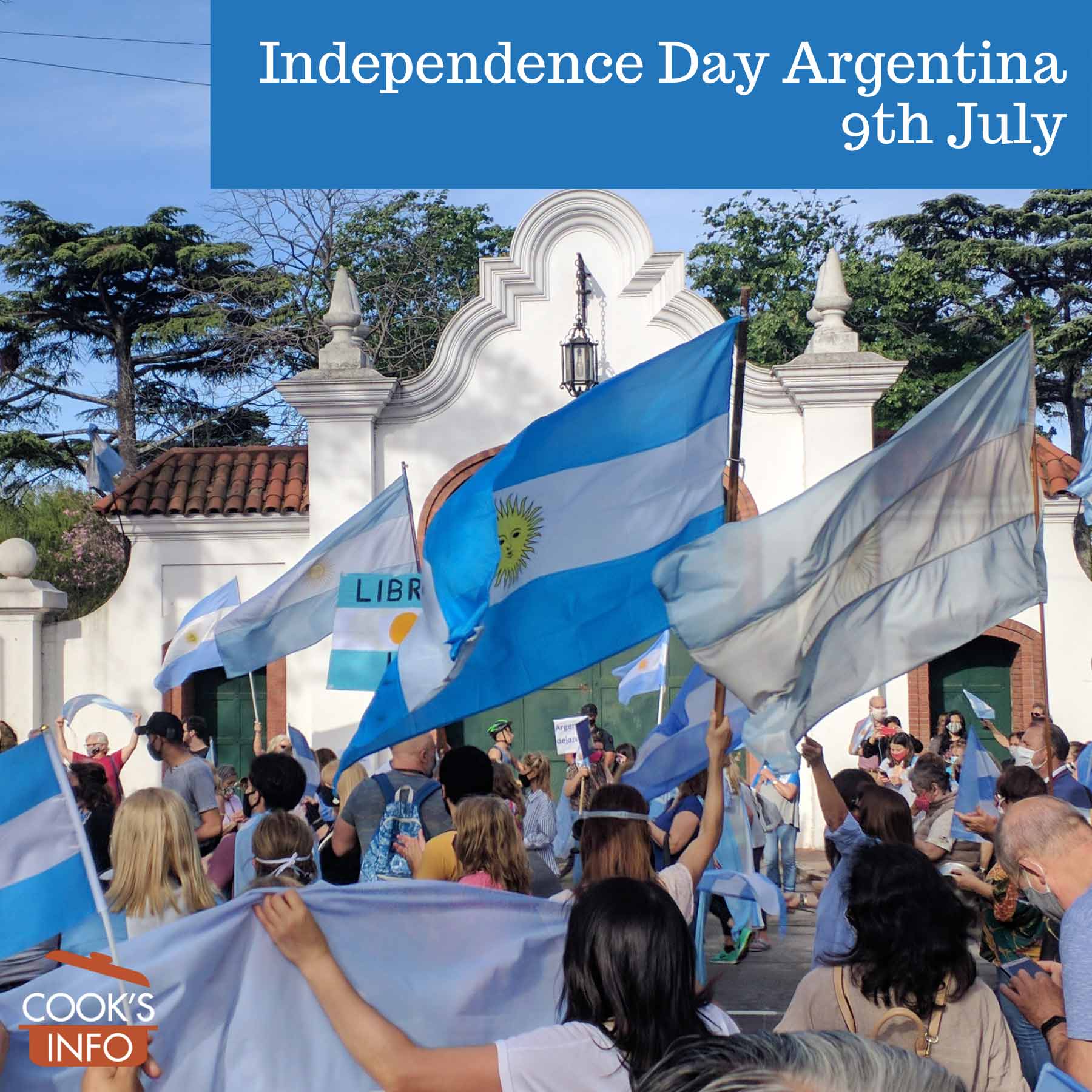 Crowd of people waving Argentine flags