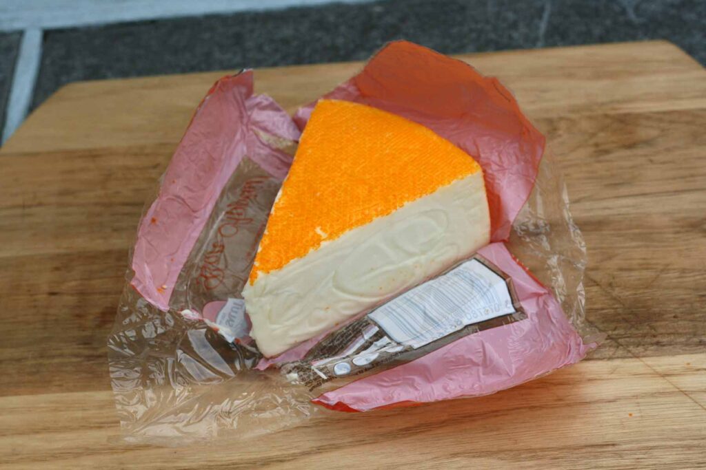 Port Salut Cheese wedge in packaging