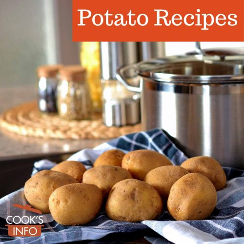 Unpeeled potatoes next to a pot