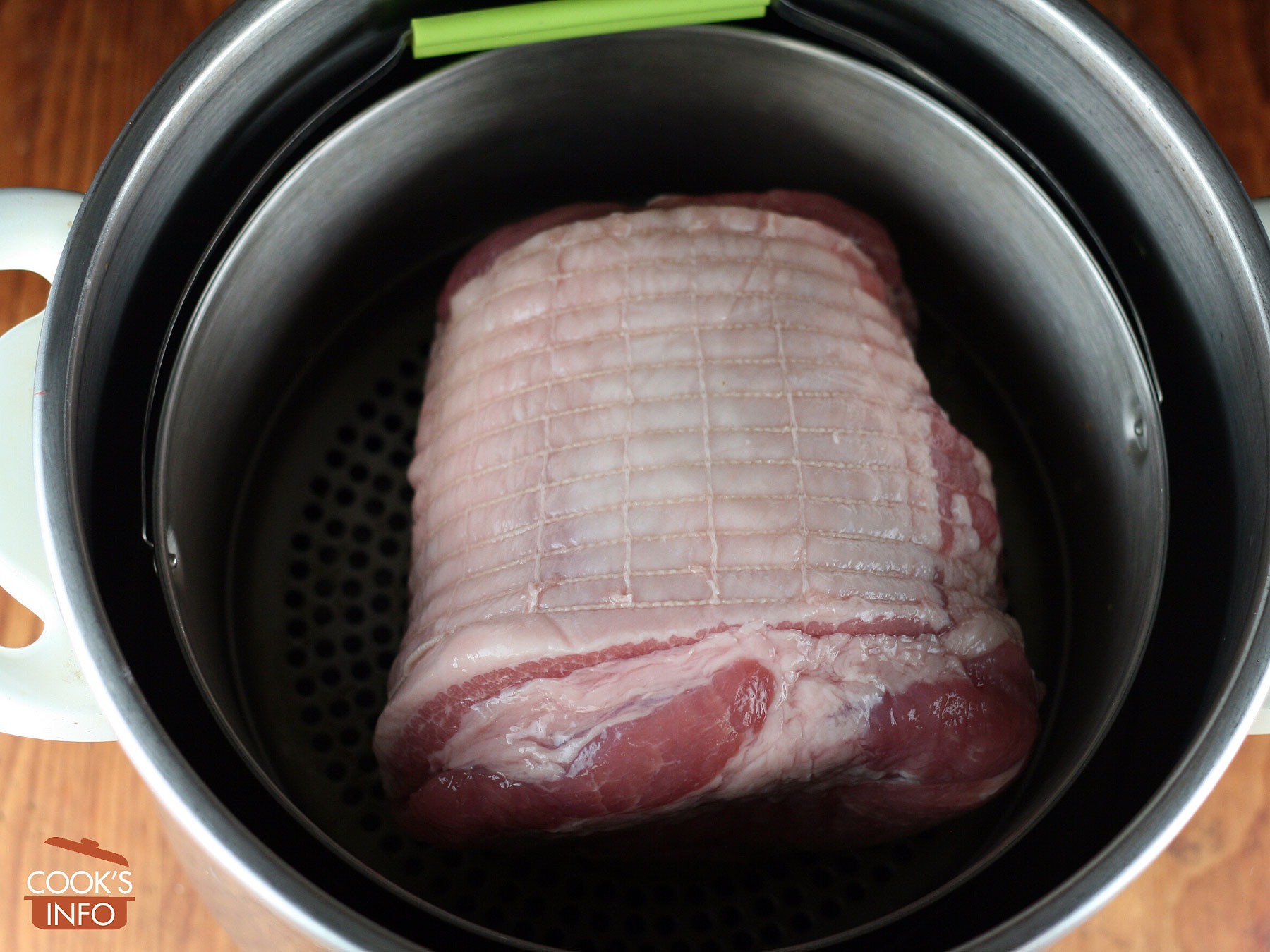 Sweet pickled cottage roll in pressure cooker basket