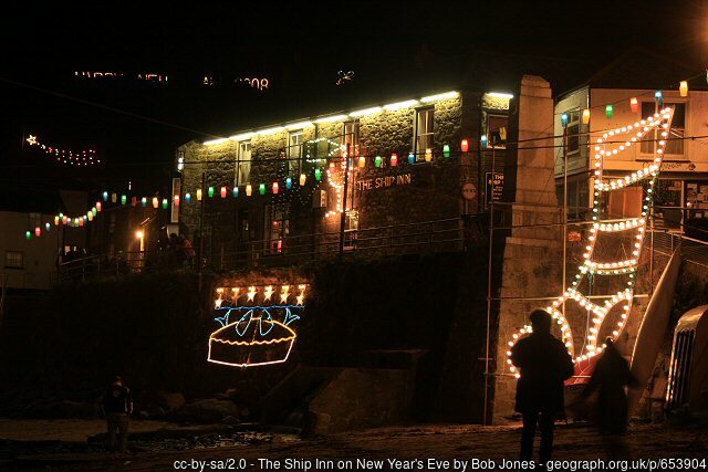 The Ship Inn with a picture of the famous stargazy pie in lights