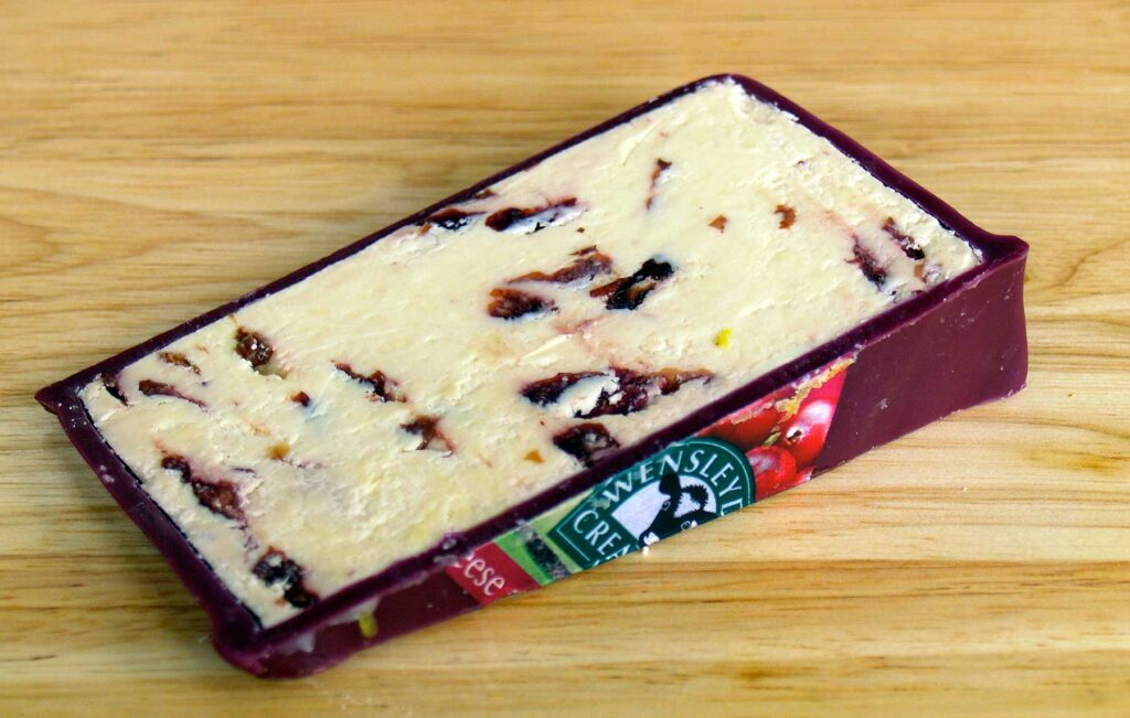 Wensleydale Cheese with Cranberries showing red wax coating