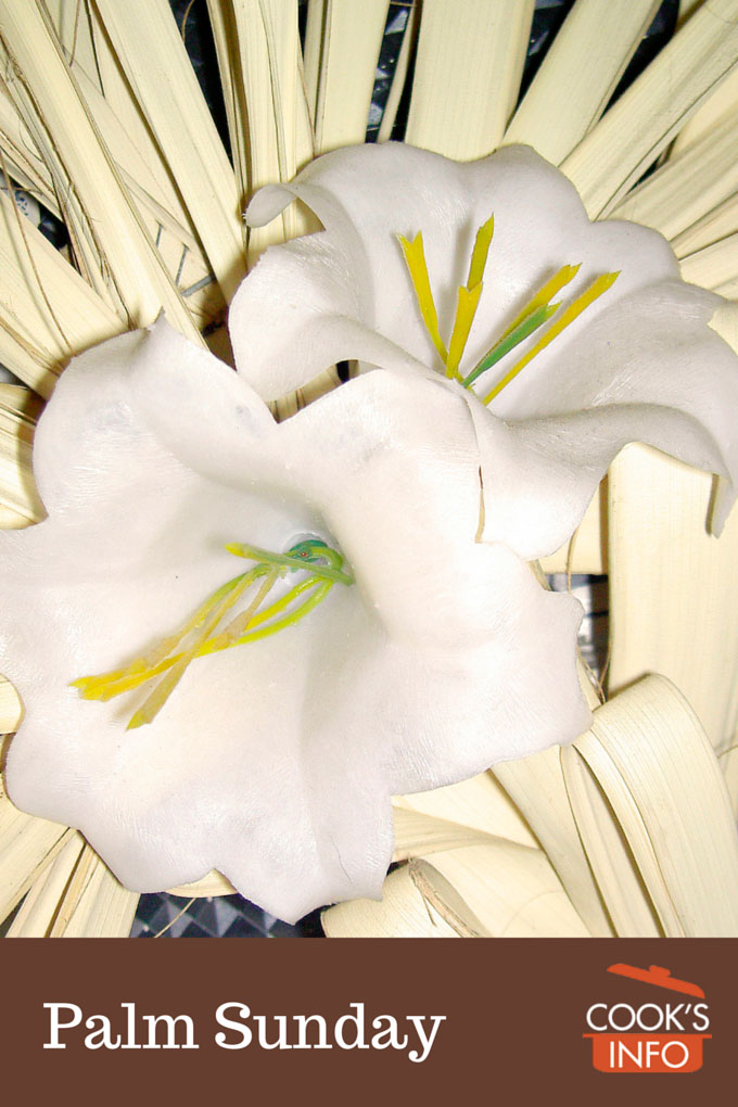 Easter lily on background of palm fronds
