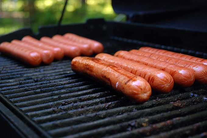 Wiieners cooking on a grill